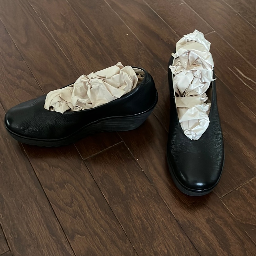 Fly London Black Leather Wedge Slip-On Clogs